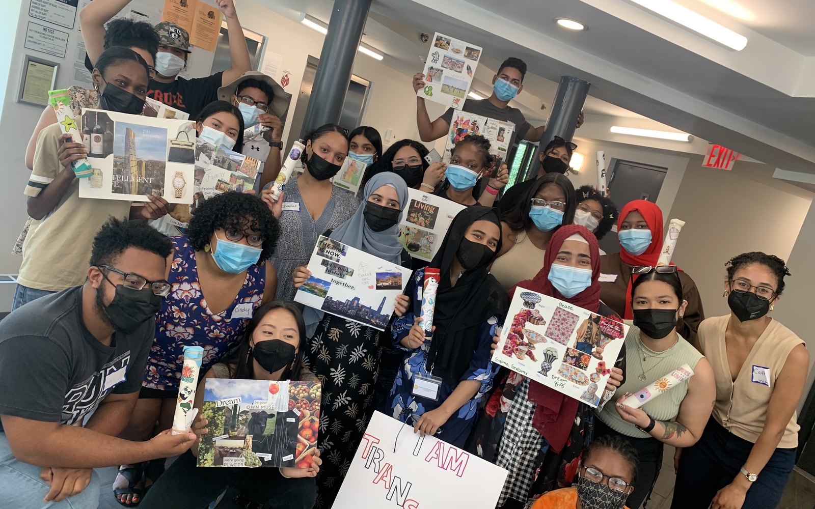 BON Transfer Bootcamp participants hold vision boards they created together